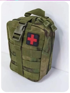 Tactical medical pouch featuring MOLLE webbing with red cross patch and camouflage pattern