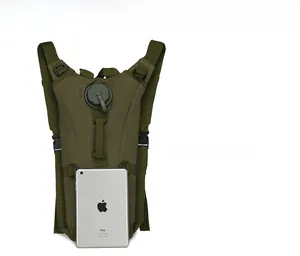 Tactical water hydration backpack in army green shown next to an iPad for size comparison