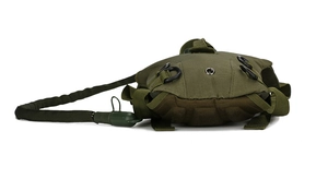 Detail view of military green tactical backpack with hydration hose and metal D-rings