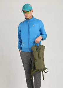 Olive tactical hydration backpack with D-rings and water cap shown on male model