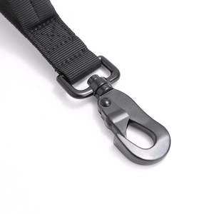 Close-up of matte black tactical metal buckle and heavy-duty reinforced nylon webbing
