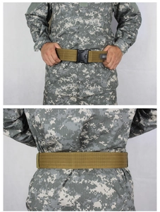 Detail of khaki nylon tactical belt with quick-release buckle on digital camo uniform