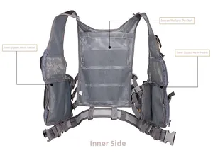Detail of gray tactical vest showing breathable mesh lining and inner zipper pockets