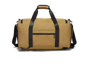 Rear view of the khaki tactical gym bag featuring reinforced black handles and waterproof fabric