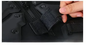 Detail of waterproof tactical vest with heavy-duty metal zipper and velcro closure