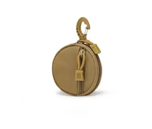 Side view of a coyote brown tactical nylon coin pouch with a plastic hanging clip
