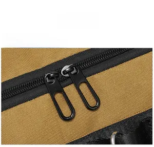 Close-up of durable dual metal zippers on a heavy-duty tactical canvas travel bag