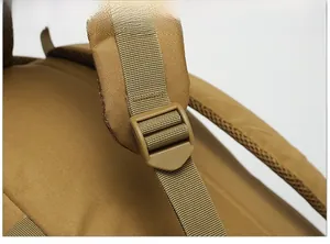 Close-up of durable tactical buckle and reinforced nylon webbing on khaki hiking backpack