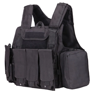 Detail of black tactical vest showing magazine pouches and breathable mesh lining