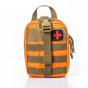 Tactical medical first aid kit in bright orange nylon with MOLLE system and red cross patch