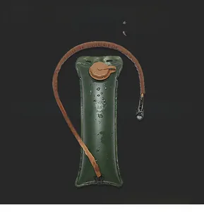 Macro shot of 3L food grade TPU hydration bladder with insulated brown hose and screw cap