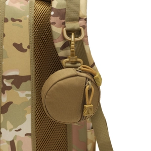 Tactical khaki nylon pouch with swivel hook attached to a camouflage outdoor backpack