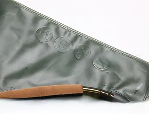 Detail of army green TPU hydration bladder with reinforced seams and insulated hose cover
