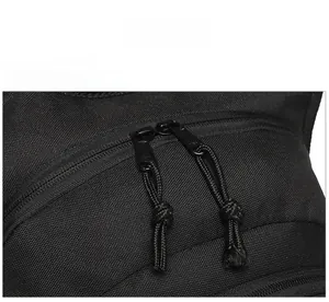 Macro detail of paracord zipper pullers and black water-resistant tactical fabric
