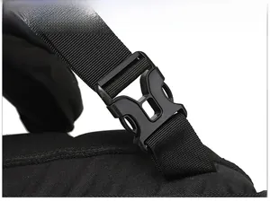 Detail of durable black plastic buckle and nylon webbing on a tactical backpack