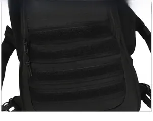 Detail of military MOLLE webbing system and velcro patch area on black tactical backpack