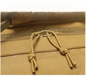 Detailed macro view of durable paracord zipper pullers on a khaki tactical backpack