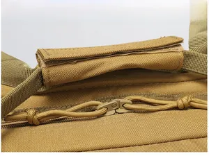Detail of reinforced padded handle and heavy-duty dual zippers on tactical backpack