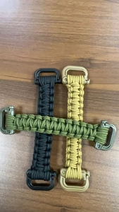 Detail of woven paracord handles for outdoor water bottles in black green and sand colors