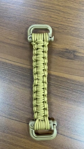 Detailed shot of army green paracord woven water bottle handle with secure plastic buckles