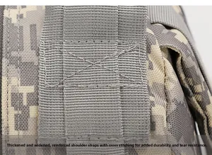 Detail of reinforced cross-stitching on thickened shoulder straps of camo tactical backpack