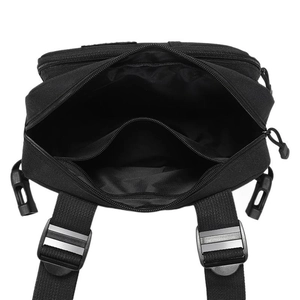 Tactical black nylon chest bag showing internal compartments and durable zipper closure