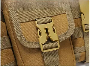 Close-up of tactical tan backpack showing durable plastic buckle and MOLLE webbing system