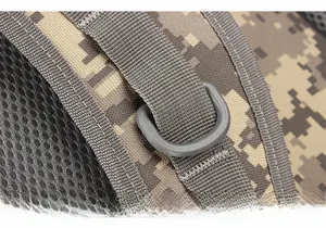 Macro detail of high-strength D-ring and reinforced stitching on digital camo tactical bag