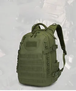 Detailed view of green tactical backpack with MOLLE webbing and paracord handle grip