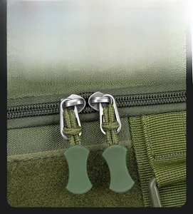 Close-up of durable army green fishing bag with smooth two-way metal zippers and paracord pulls
