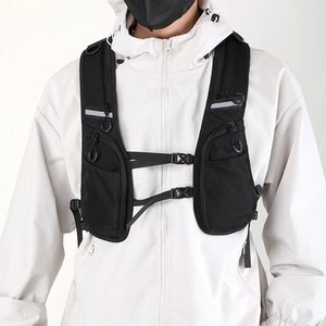 Detail of black cycling vest pack showing breathable mesh and adjustable buckle system