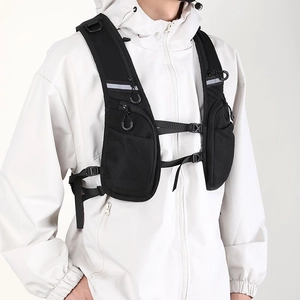 Detail of black outdoor cycling vest with zipper pockets and reflective safety strips