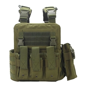Close-up of military green tactical vest showing MOLLE webbing and quick-release buckles