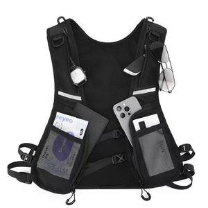 Detail of waterproof cycling vest bag showing pockets with phone and sunglasses storage