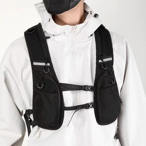 Macro detail of black tactical running vest with water-resistant nylon and mesh pockets