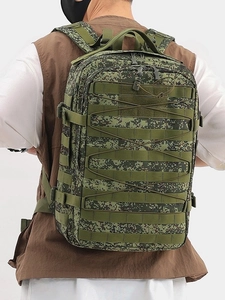 Macro shot of EMR digital camouflage tactical backpack showing MOLLE webbing system and straps