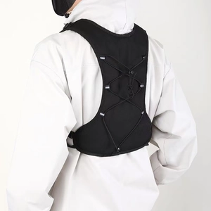 Rear view of lightweight hydration vest featuring six reflective strips and adjustable cords