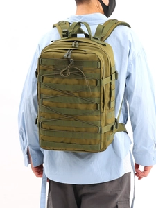 Detail showing tactical backpack with MOLLE system and nylon straps on a male model