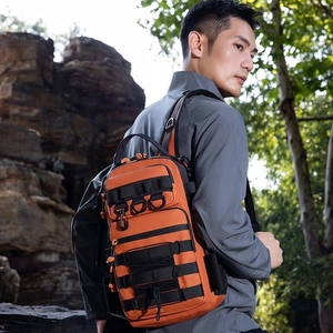 Tactical bright orange camouflage shoulder bag with MOLLE system for hiking outdoors