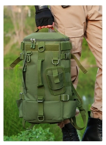 Detail of army green tactical fishing backpack with MOLLE system and durable handle