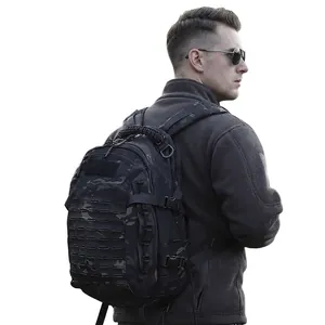 Tactical camouflage backpack with laser-cut Molle system on a male model for outdoors