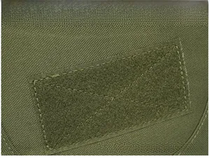 Detail of the tactical backpack featuring a durable olive green nylon fabric with velcro patch
