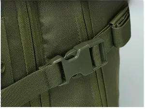 Detail of durable olive green quick-release plastic buckle on tactical outdoor backpack