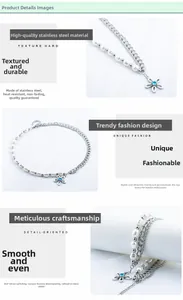Detail of stainless steel necklace featuring white pearls and a blue floral pendant charm