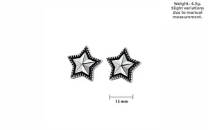 Detail showing 15mm vintage star earrings in textured stainless steel with black finish