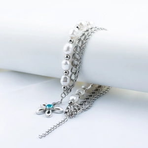 Multilayer titanium steel necklace with white pearls and a blue floral gemstone pendant