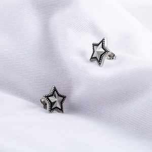 Minimalist vintage star stud earrings in silver steel finish with embossed geometric texture