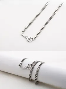Detail of silver Luck bunny pendant in stainless steel with a flat cable chain design