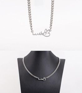 Macro view of silver luck rabbit pendant and Cuban chain for a stylish unisex necklace