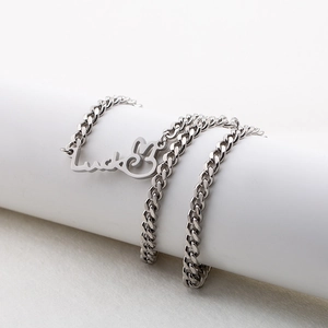 Silver stainless steel Luck rabbit pendant necklace on a minimalist display stand